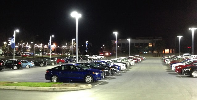 An automotive dealership lot featuring LED lighting